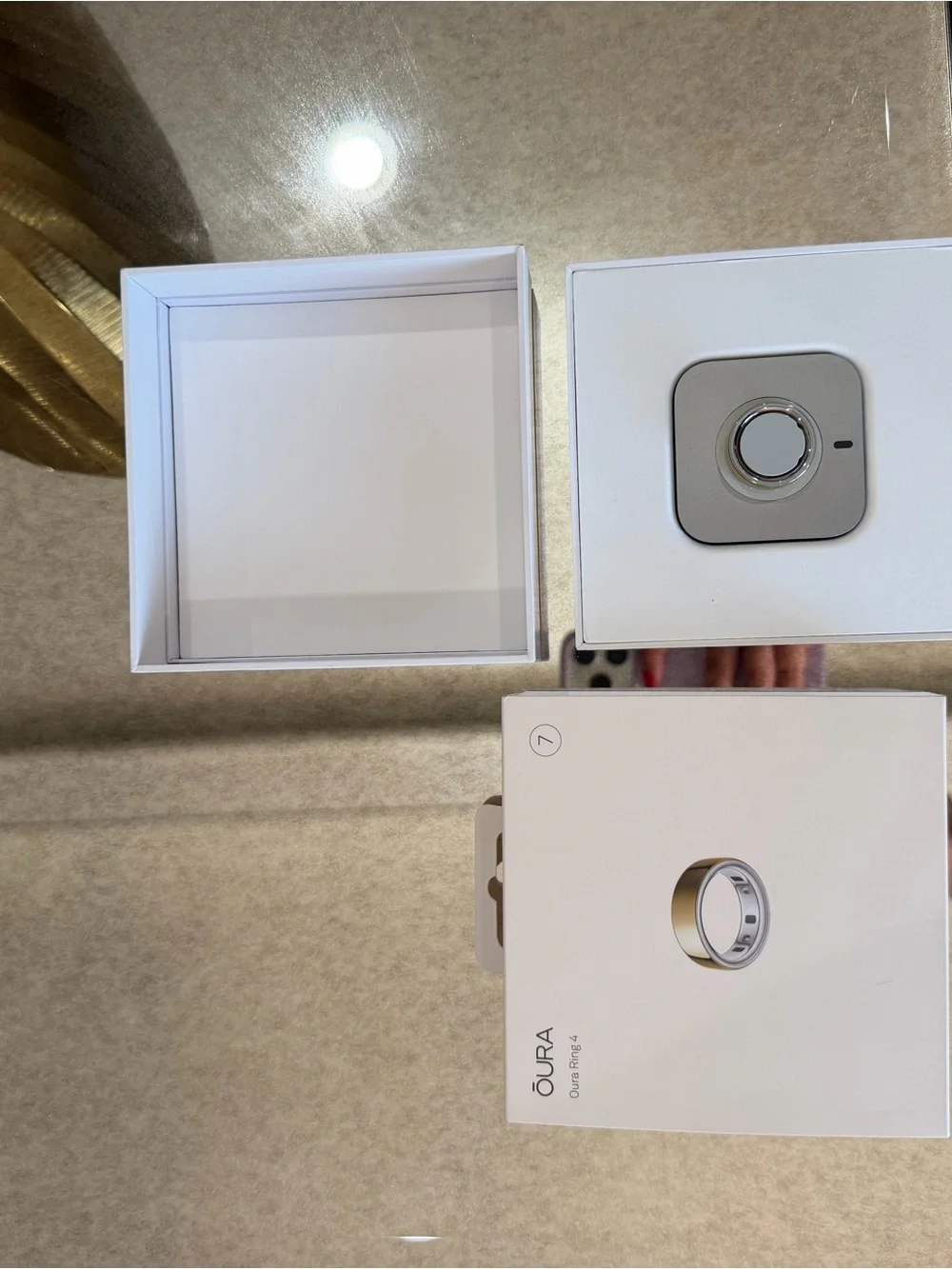 Oura Box with Gold Accents and White Packaging